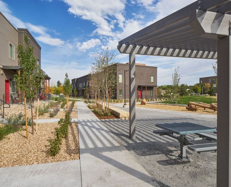 A picture showing B Building and the playground from under the veranda.